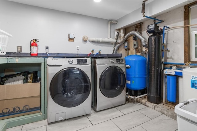 clothes washing area featuring separate washer and dryer