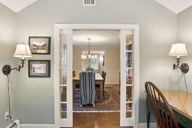 5 Coburn Rd, Hopkinton, MA 01748 - dining area featuring lofted ceiling, a baseboard heating unit, wood finished floors, a chandelier, and baseboards