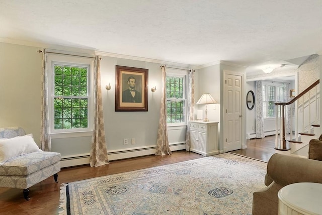 5 Coburn Rd, Hopkinton, MA 01748 - living area featuring wood finished floors, ornamental molding, stairs, baseboard heating, and a textured ceiling