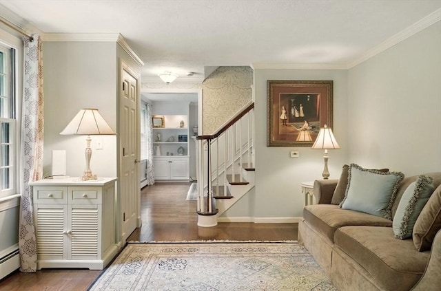 5 Coburn Rd, Hopkinton, MA 01748 - foyer entrance featuring wood finished floors, stairs, baseboard heating, ornamental molding, and plenty of natural light