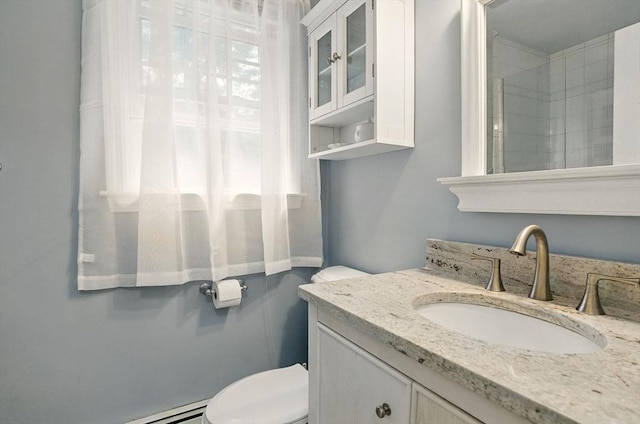 5 Coburn Rd, Hopkinton, MA 01748 - bathroom featuring vanity, toilet, and baseboard heating