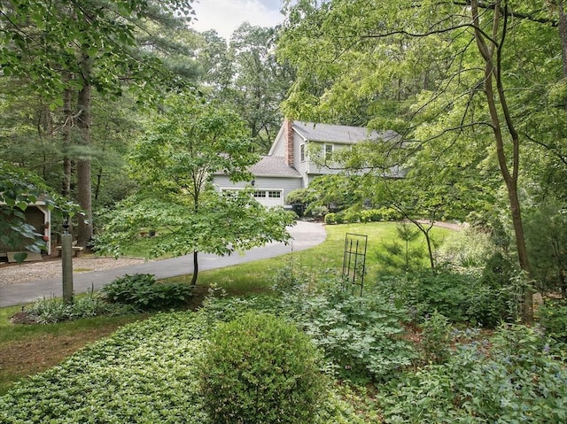 5 Coburn Rd, Hopkinton, MA 01748 - view of yard with driveway and an attached garage