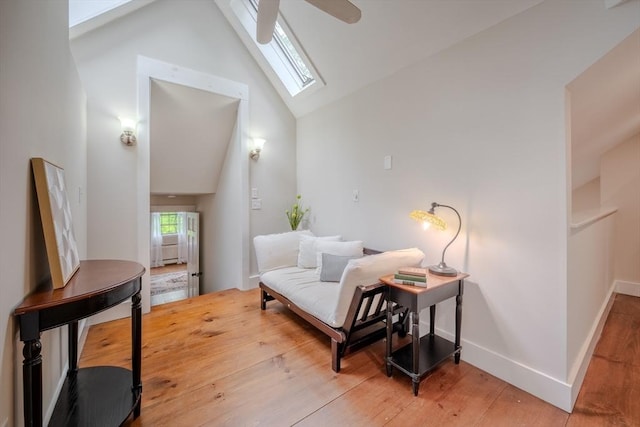 43 Mill Rd, North Andover, MA 01845 - living area featuring light wood-type flooring, a skylight, ceiling fan, and high vaulted ceiling