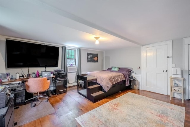 43 Mill Rd, North Andover, MA 01845 - bedroom with wood finished floors, a desk, and a baseboard radiator
