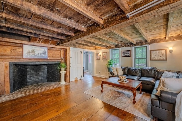 43 Mill Rd, North Andover, MA 01845 - living area featuring a wood ceiling with exposed beams, hardwood / wood-style floors, and a high end fireplace