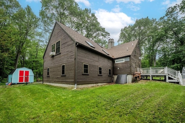 43 Mill Rd, North Andover, MA 01845 - rear view of house featuring a shed, a wooden deck, a chimney, and a shingled roof