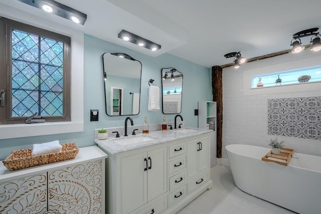43 Mill Rd, North Andover, MA 01845 - full bath with plenty of natural light, double vanity, and a freestanding bath