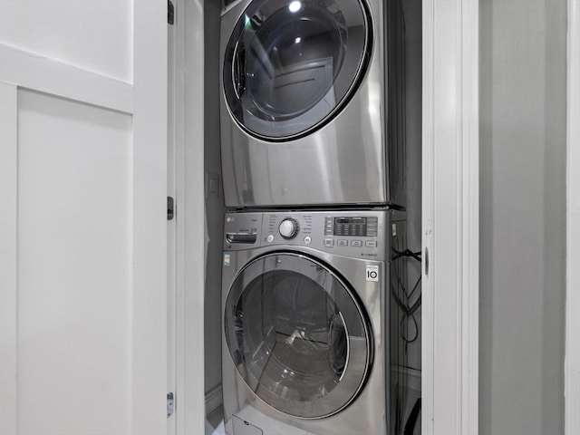 laundry area featuring stacked washer / dryer