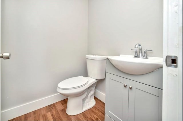 225 Washington, Boston, MA 02121 - half bathroom featuring vanity and wood finished floors