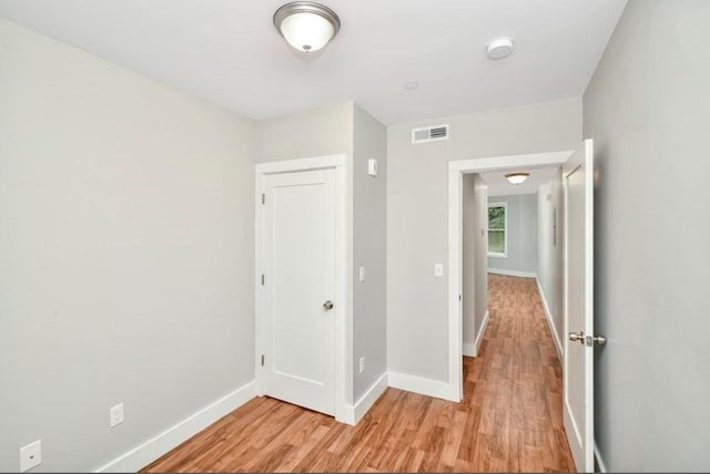 225 Washington, Boston, MA 02121 - unfurnished bedroom featuring light wood finished floors