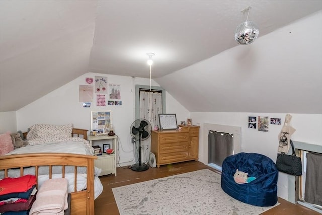 bedroom featuring vaulted ceiling and wood finished floors