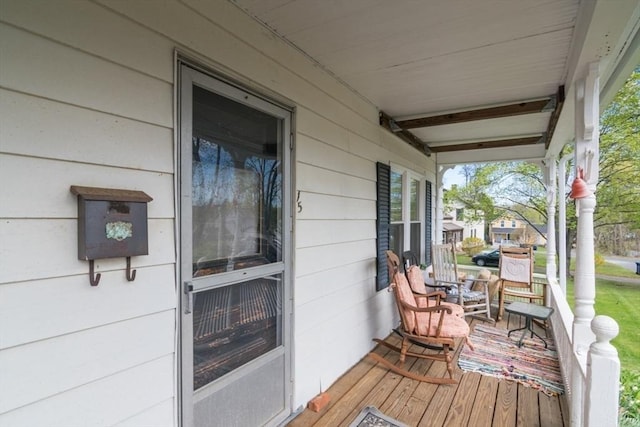 wooden deck featuring covered porch