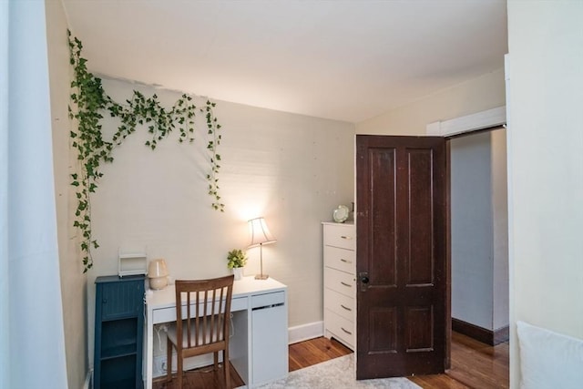 home office with wood finished floors and baseboards