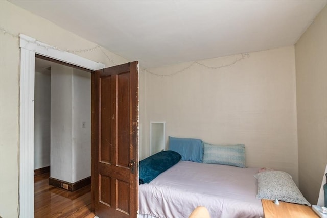 bedroom featuring wood finished floors