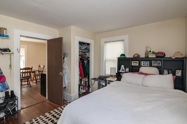 bedroom with hardwood / wood-style flooring and a closet