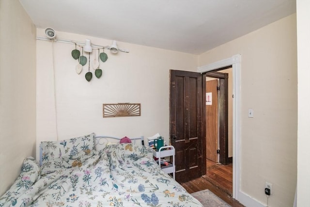 bedroom featuring wood finished floors