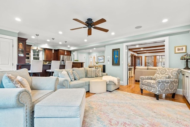 living room with light wood-type flooring, crown molding, and recessed lighting