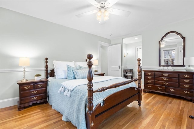 bedroom featuring ceiling fan, light wood-type flooring, and baseboards