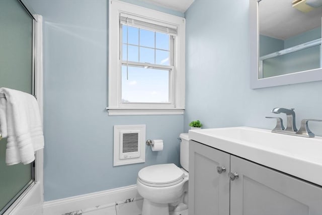 full bathroom featuring combined bath / shower with glass door, vanity, toilet, and baseboards