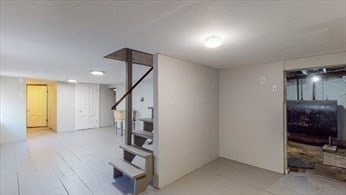 basement with light wood-type flooring