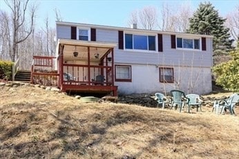 back of property with a deck