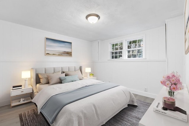 bedroom featuring wood finished floors