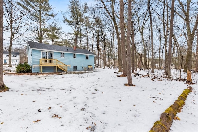 view of snow covered house