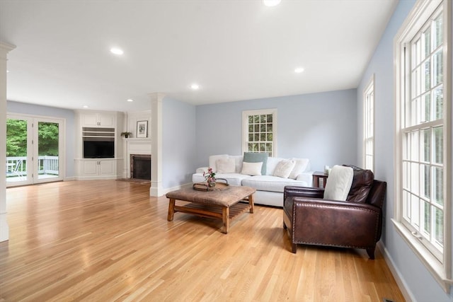 7 Cider Hill Ln, Sherborn, MA 01770 - living area featuring plenty of natural light, light wood finished floors, ornate columns, and recessed lighting