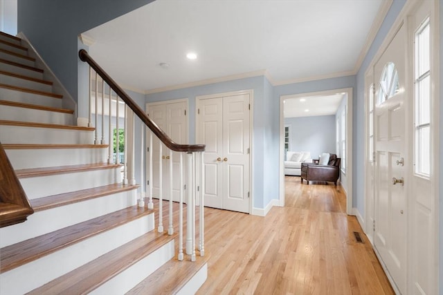 7 Cider Hill Ln, Sherborn, MA 01770 - foyer with stairs, light wood-style flooring, ornamental molding, baseboards, and recessed lighting