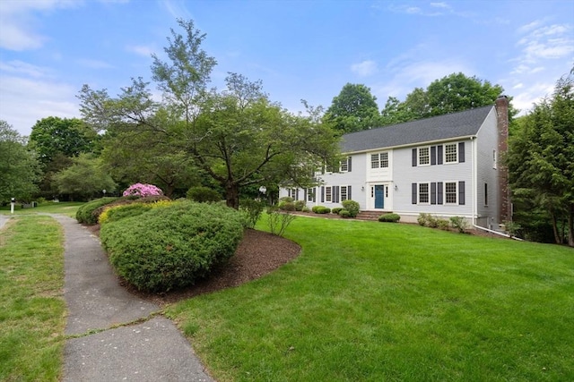 7 Cider Hill Ln, Sherborn, MA 01770 - view of front facade featuring a chimney and a front yard