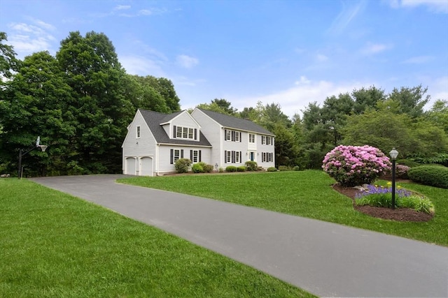 7 Cider Hill Ln, Sherborn, MA 01770 - colonial inspired home featuring an attached garage, a front lawn, and asphalt driveway