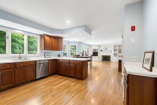 7 Cider Hill Ln, Sherborn, MA 01770 - kitchen featuring dishwasher, a peninsula, a sink, light wood finished floors, and light countertops