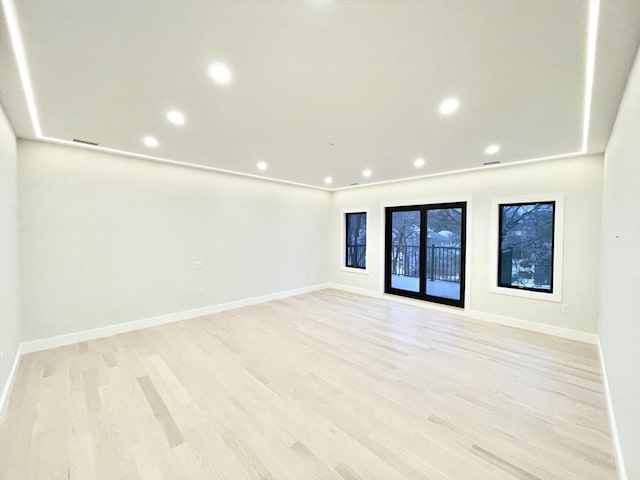 unfurnished room featuring light wood-type flooring