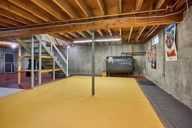 basement with oil tank and stairway