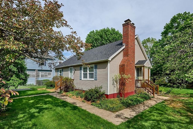 view of home's exterior featuring a chimney and a shingled roof