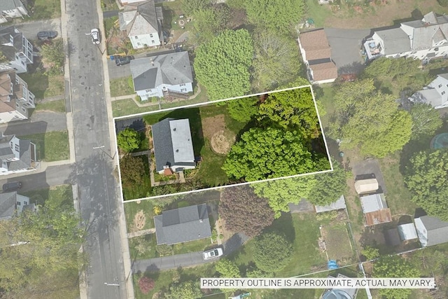 aerial view of residential area featuring property parcel outlined