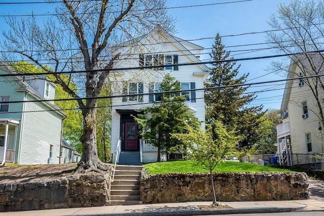 view of front of home with stairway