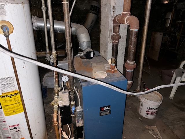 utility room featuring water heater