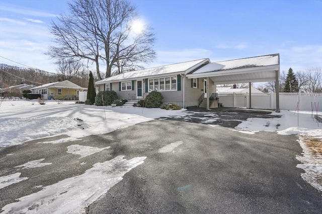 single story home featuring a carport