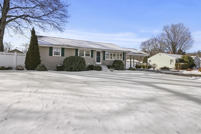 single story home featuring a carport