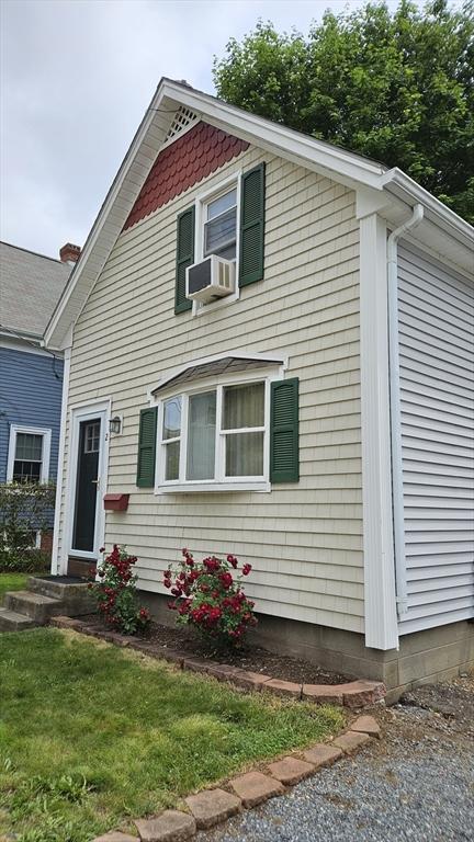 21 Morey St, Attleboro, MA 02703 - view of front facade with cooling unit and a front yard