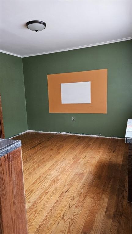 21 Morey St, Attleboro, MA 02703 - unfurnished room with wood finished floors and ornamental molding