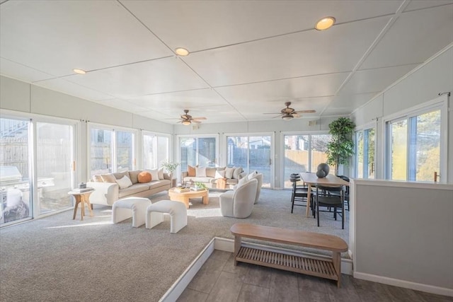 sunroom / solarium with ceiling fan