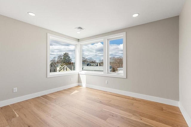 308 Newton St Unit 2, Waltham, MA 02453 - empty room with plenty of natural light, light wood-type flooring, baseboards, and recessed lighting