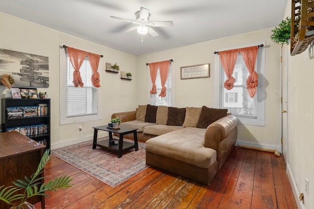 living room with dark hardwood / wood-style floors and ceiling fan