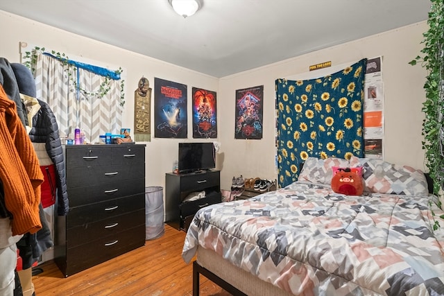 bedroom with wood-type flooring