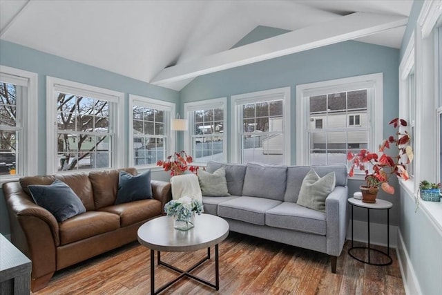 sunroom / solarium featuring vaulted ceiling