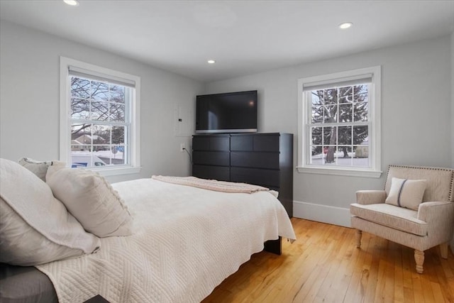 bedroom featuring recessed lighting, baseboards, and light wood finished floors