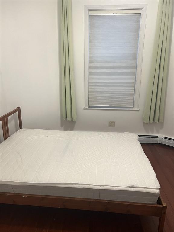 bedroom with wood finished floors