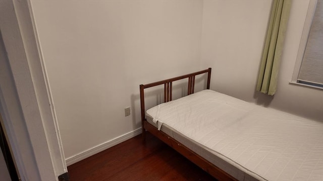 bedroom featuring wood finished floors